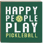 A green decorative wooden block with white text that reads 'HAPPY PEOPLE PLAY PICKLEBALL' and an illustration of a pickleball. Available at Be Charmed