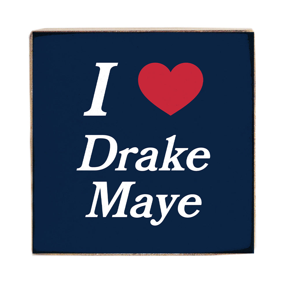 Navy blue square sign with 'I ❤️ Drake Maye' text on a white background. Available at be Charmed