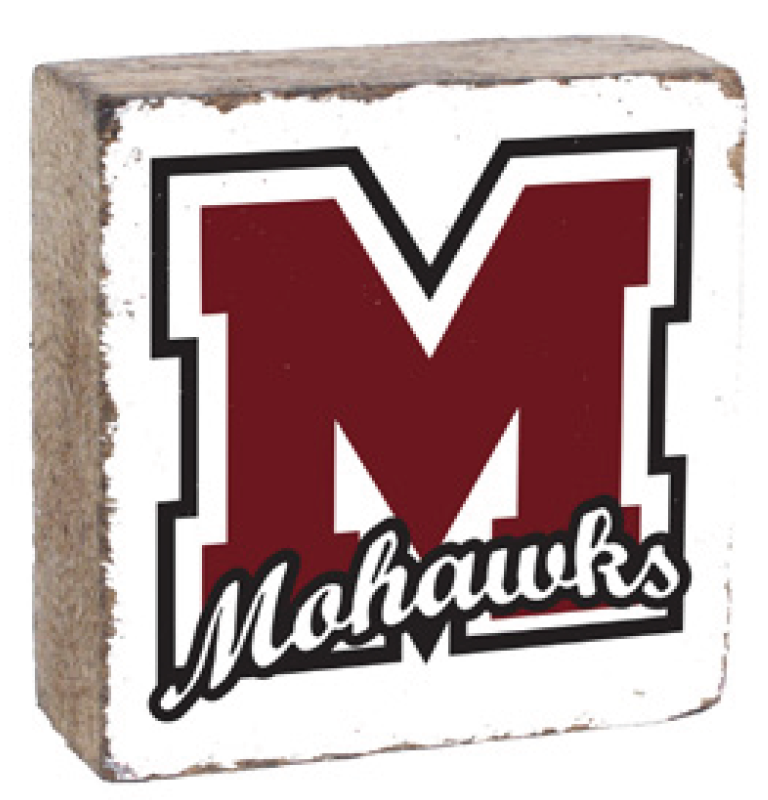 A Rusttic marlin decorative block with a white background featuring a black 'M' and the word 'MARLINS' in a script typeface, on a wooden surface. Available at Be Charmed