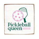 A Rustic Marlin wooden block sign with a white background featuring a graphic of a pickleball and the text 'Pickleball queen'. The sign has a rustic appearance with visible wood edges.Available at e Charmed