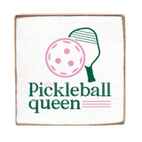 A Rustic Marlin wooden block sign with a white background featuring a graphic of a pickleball and the text 'Pickleball queen'. The sign has a rustic appearance with visible wood edges.Available at e Charmed