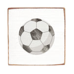 Soccer ball design on a square rustic wood block with a white background. Available at Be Charmed