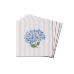 A stack of square coasters with a hydrangea floral pattern on a striped blue and white background. Available at Be Charmed