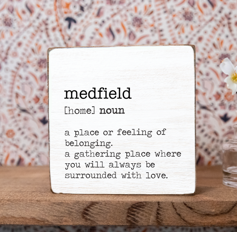 Rustic Marlin Medfield Definition 6x6 Block on shelf with a heartfelt definition of Medfield on hand-painted wood—perfect for hometown pride, available at Be Charmed