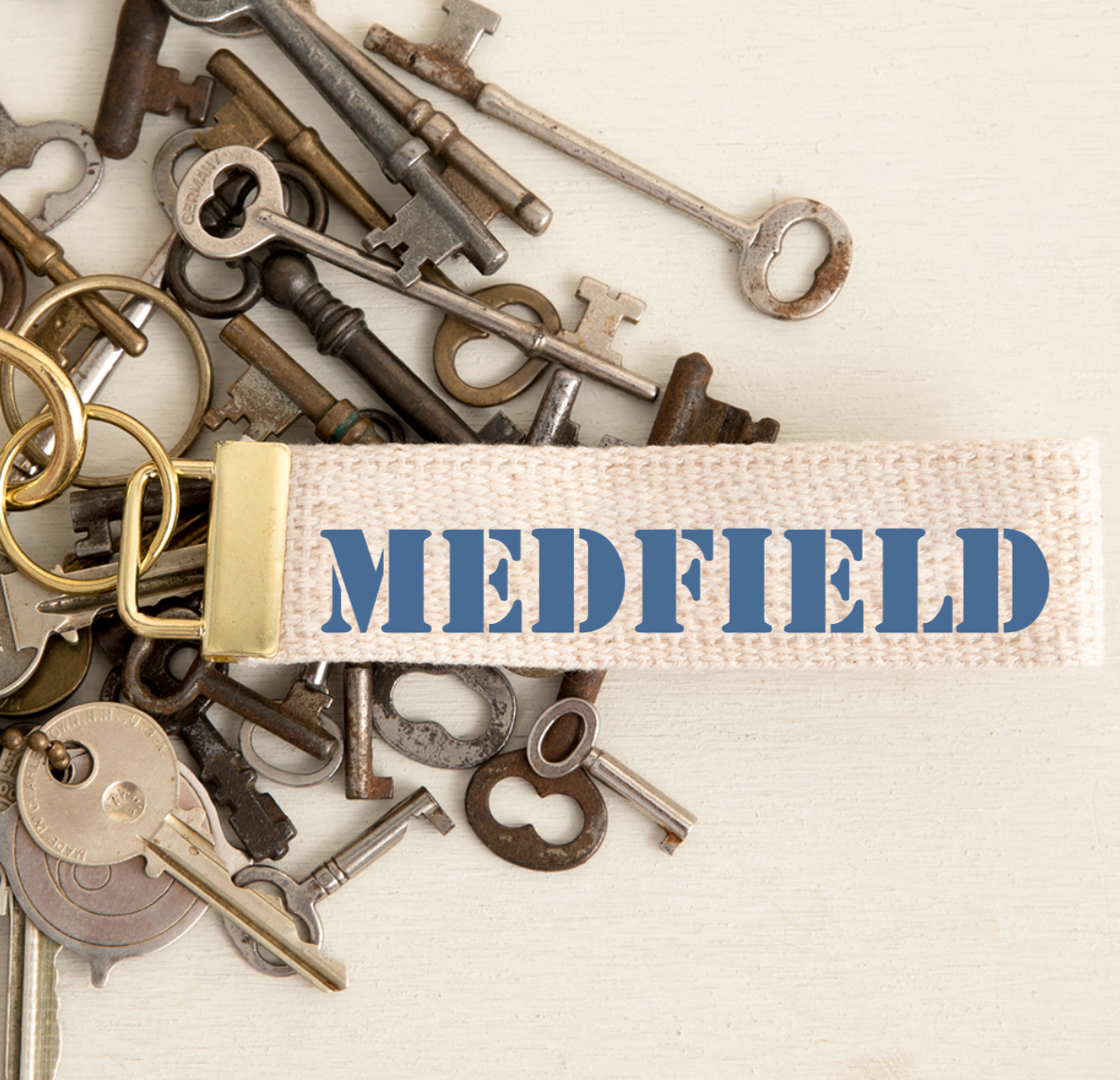 Rustic Marlin Medfield Key Chain featuring a handcrafted design, perfect for displaying Medfield pride. Available at Be Charmed.