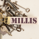 Rustic Marlin Millis Key Chain featuring a handcrafted design, perfect for displaying Millis pride. Available at Be Charmed.