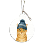 Round ornament with a cat wearing a blue beanie labeled 'Medfield' on a white background. Available at Be Charmed