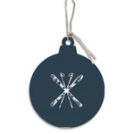 Navy blue Christmas ornament with white ski and snowflake design on a white background. Available at Be Charmed