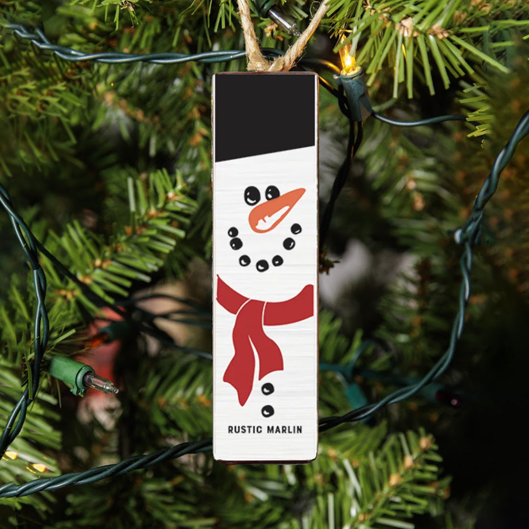 Rustic Marlin Ornament featuring a Snowman design. Perfect Christmas or winter décor or gift. Available at Be Charmed