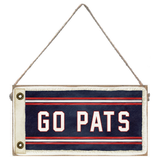 Wood sign with 'GO PATS' text on a white background. Available at Be Charmed