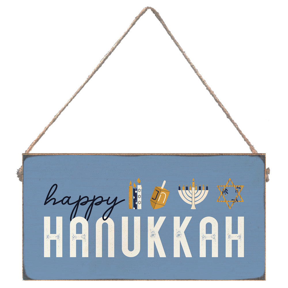 Hanging sign with 'Happy Hanukkah' text and symbols on a blue background. Available at Be Charmed