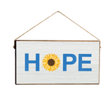 A Rustic Marlin wooden sign with a 'Hope' text and a sunflower illustration, hanging against a neutral background. Available at Be Charmed