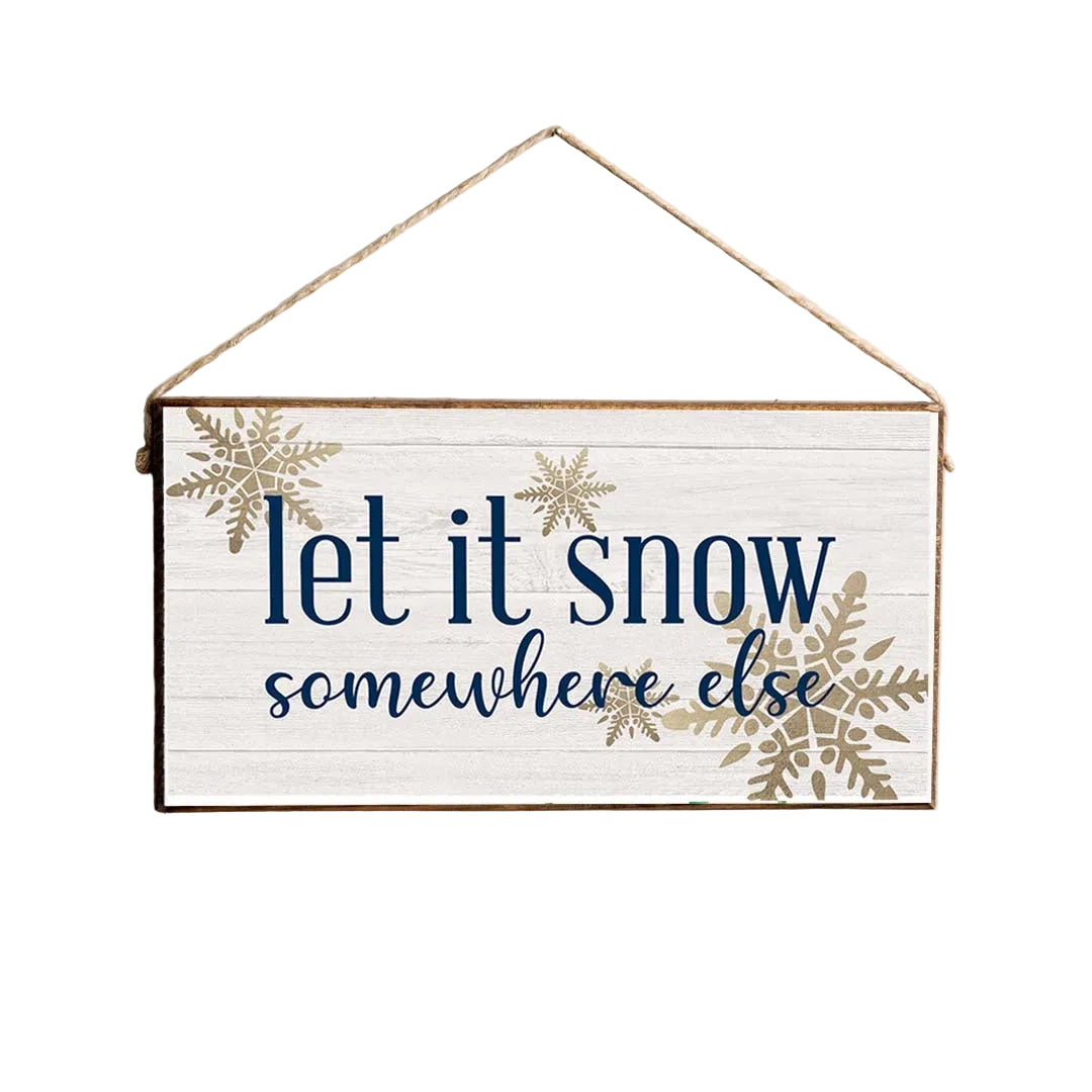 A rustic pine twine sign with the text 'Let it snow somewhere else' and decorative snowflake patterns, attached twine for hanging .Available at Be Charmed