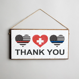A rustic marlin wooden twine sign with a 'Thank You' message, featuring hearts and a medical emblem. Available at Be Charmed