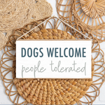 Rustic Marlin Dogs Welcome Twine Sign hanging on wall