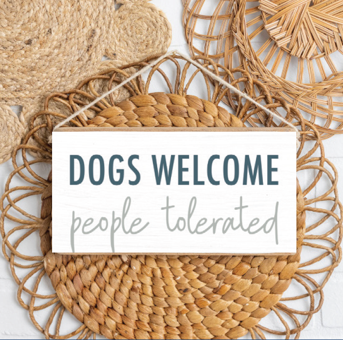 Rustic Marlin Dogs Welcome Twine Sign hanging on wall