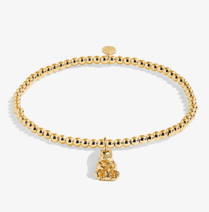 A Littles & Co Mama Bear gold bracelet featuring a delicate gold charm on a beaded band, available at Be Charmed