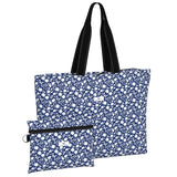 Blue floral tote bag with black handles on a white background. Available at Be Charmed