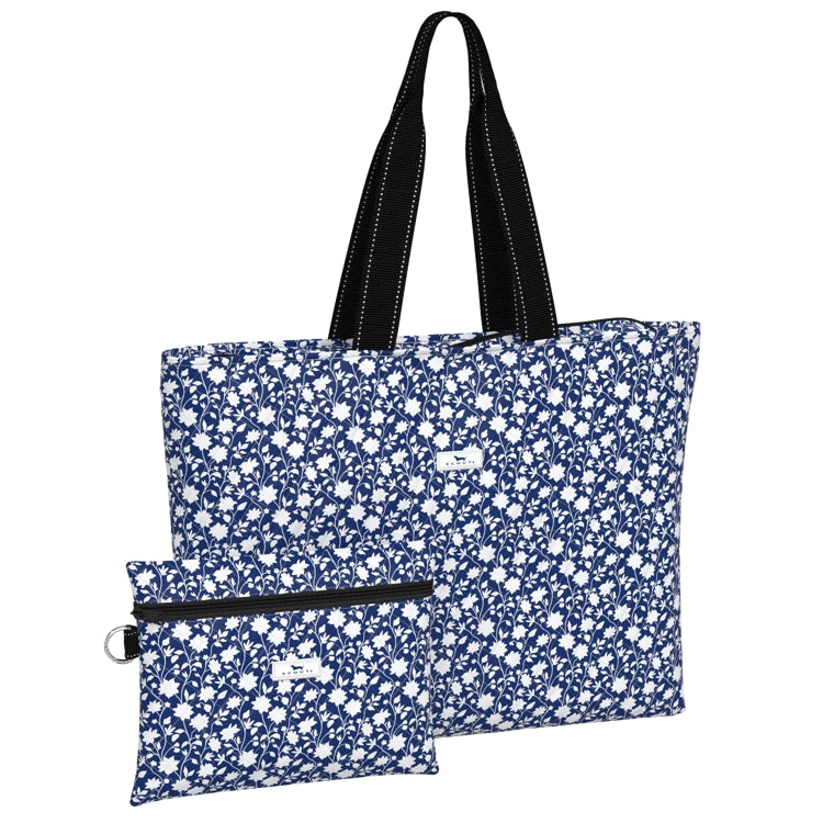 Blue floral tote bag with black handles on a white background. Available at Be Charmed