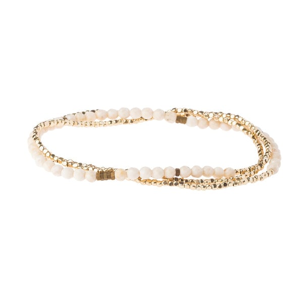 Delicate Stone Bracelet in White Fossil by Scout Curated Wears. Known as the Stone of Nurturing. Lightweight, calming, and stackable. Available at Be Charmed.