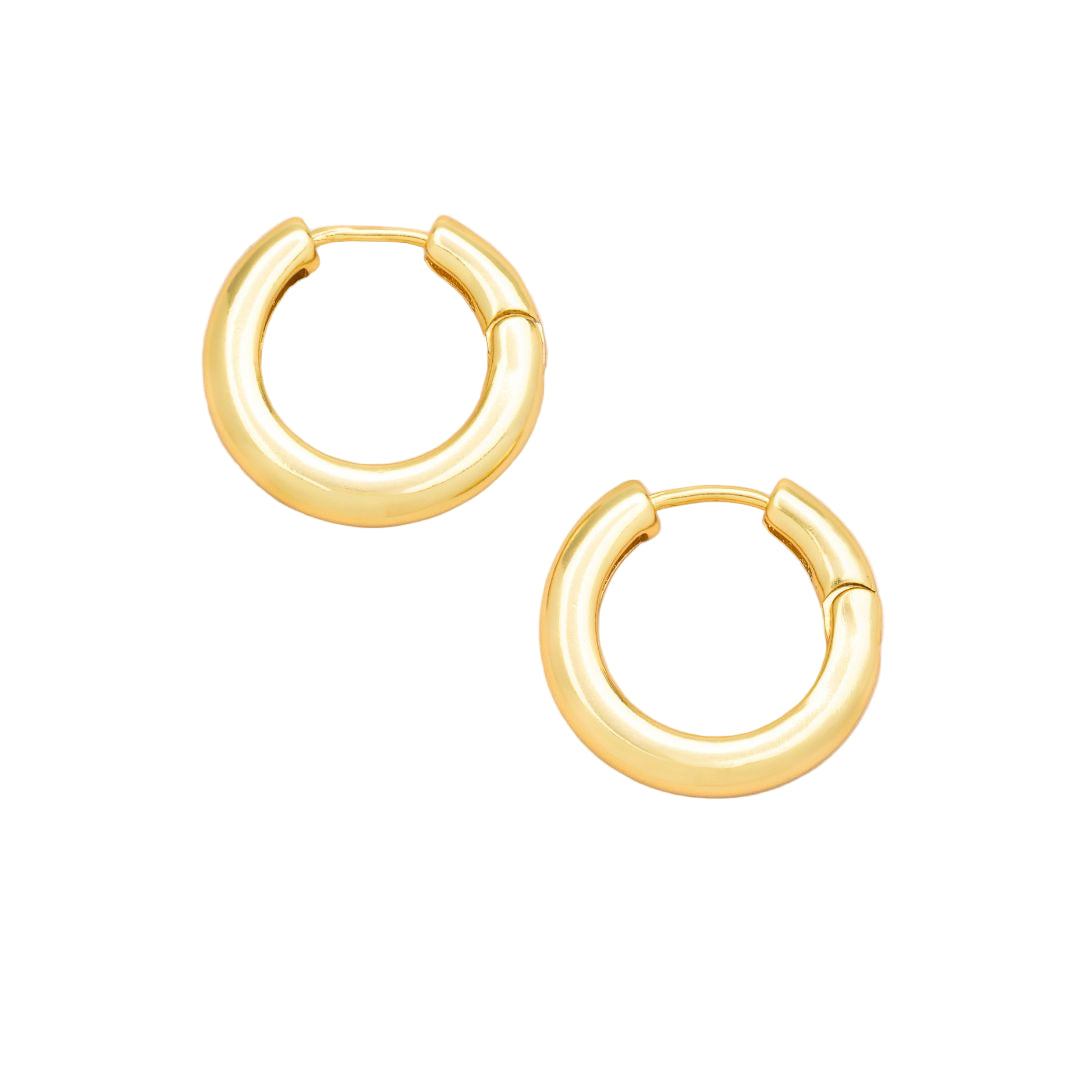 Gold hoop earrings on a white background. Available at Be Charmed.