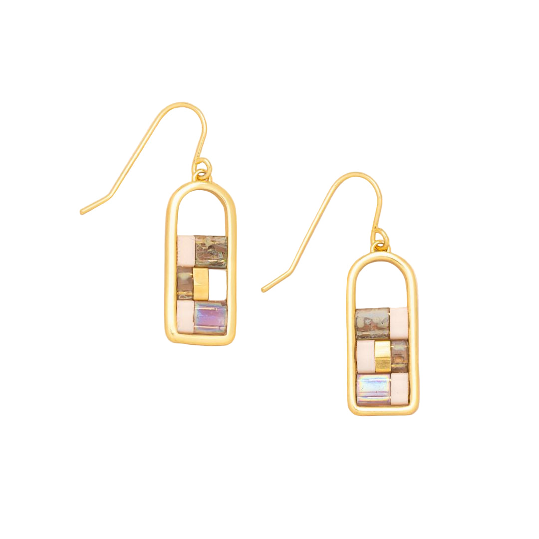 Gold earrings with colorful rectangular stones on a beige background. Available at Be Charmed
