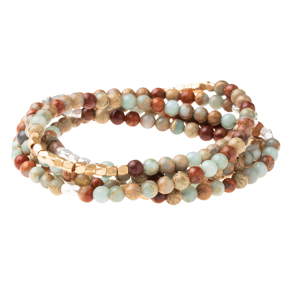 Multicolored beaded bracelet on a white background. Available at Be Charmed