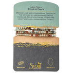 Displayed on a card Stone Wrap Bracelet/Necklace in Aqua Terra by Scout Curated Wears. Promotes peace and serenity. Versatile, calming design. Available at Be Charmed.