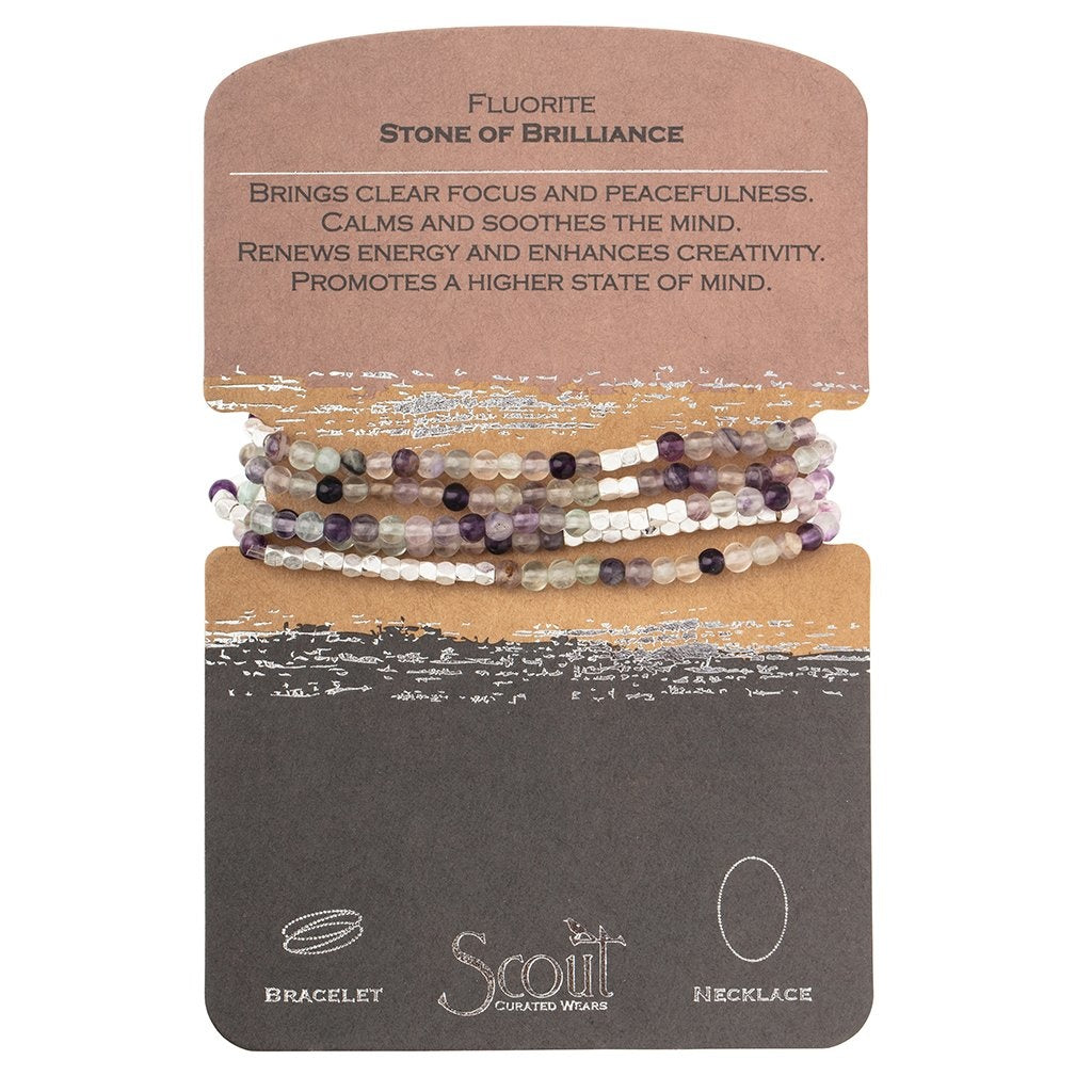 A bracelet made with semi-precious stone beads, plated brass, and stretch cord, labeled as 'Stone of Brilliance' by Scout Curated Wears.