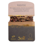 Displayed on card Stone Wrap Bracelet/Necklace in Rhodochrosite/Gold by Scout Curated Wears. Stone of Love promotes compassion. Versatile and elegant. Available at Be Charmed.