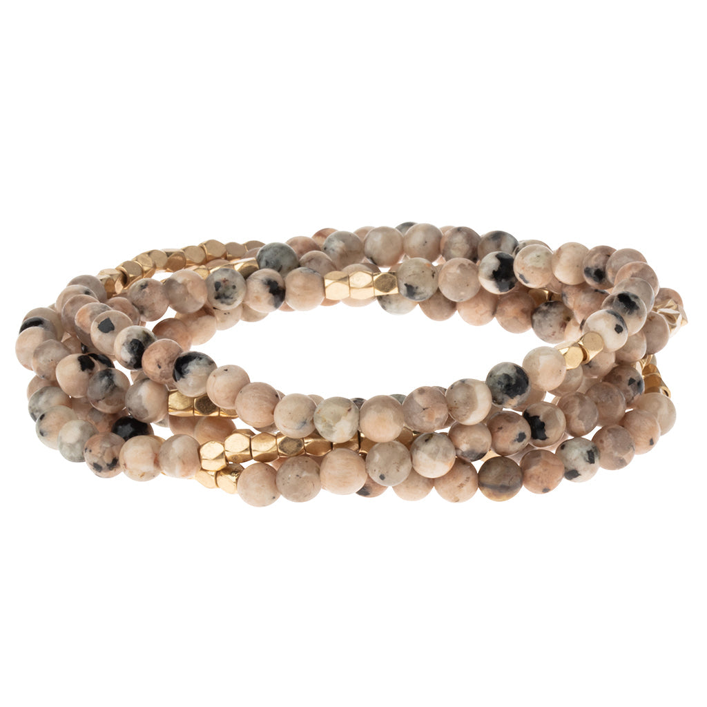 Rhodonite Stone of Healing :
Scout Curated Wears Stone Wrap – versatile beaded strand worn as wrap bracelet or necklace with natural stones, available at Be Charmed.
