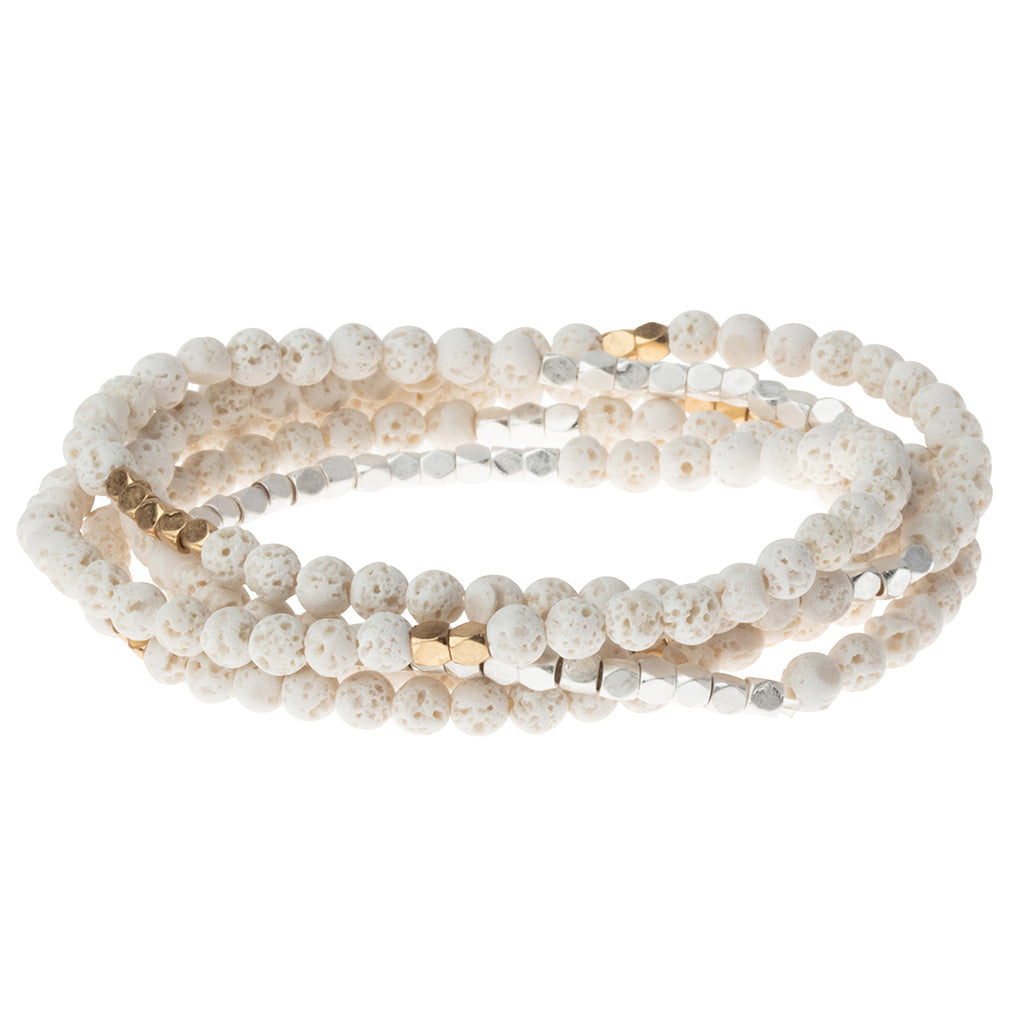 White Lava Stone of Strength Alt Text:
Scout Curated Wears Stone Wrap – versatile beaded strand worn as wrap bracelet or necklace with natural stones, available at Be Charmed.