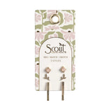 Pair of earrings on a Scout branded card with floral design. Available at Be Charmed