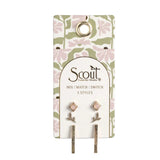 Pair of earrings on a Scout branded card with floral design. Available at Be Charmed