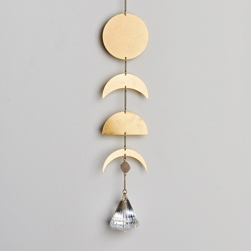 Moon Phase Suncatcher with Moonstone by Scout Curated Wears. Brings soft light, balance, and celestial charm to any space. Available at Be Charmed.
