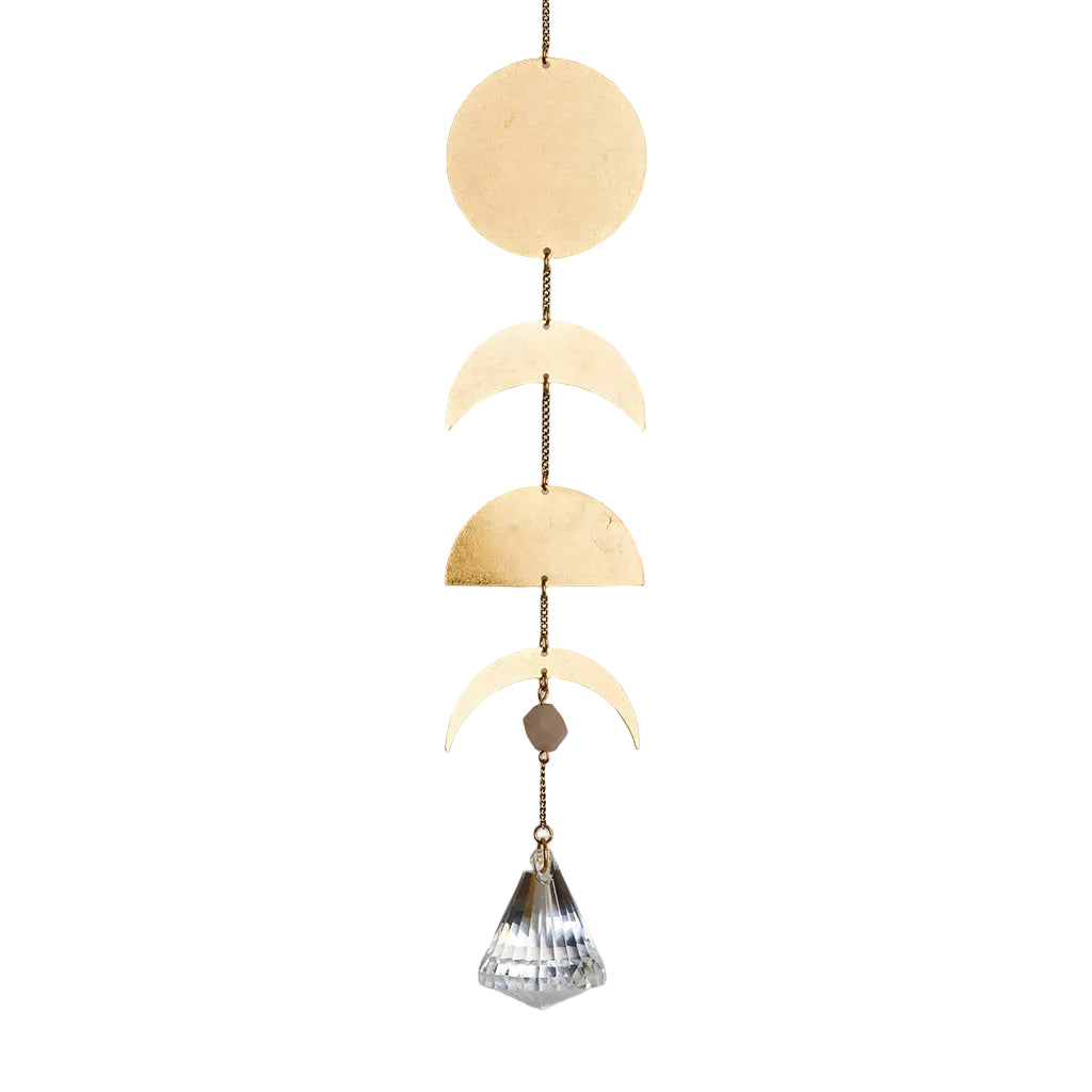 Decorative hanging suncatcher with gold moon phases and a crystal on a white background. Available at Be Charmed