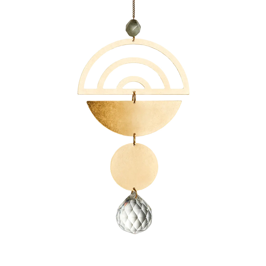 Decorative hanging suncatcher with a rainbow and geometric shapes on a white background. Available at Be Charmed