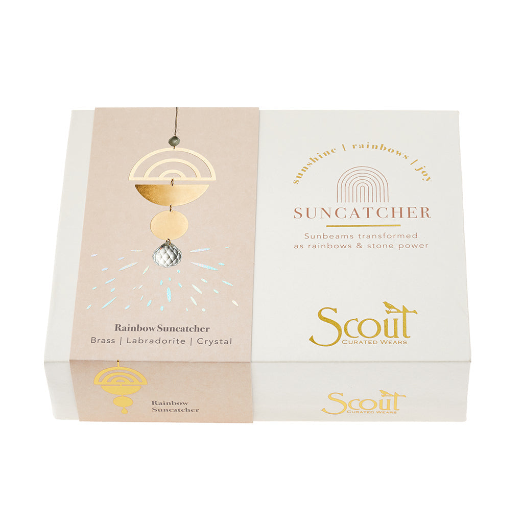 Pictured in box; Rainbow and Labradorite Suncatcher by Scout Curated Wears. Reflects light beautifully, adds boho charm to any space. Great gift. Available at Be Charmed.