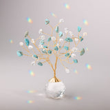 Decorative tree suncatcher with turquoise and clear beads in a clear vase on a gray background.  Available at Be Charmed