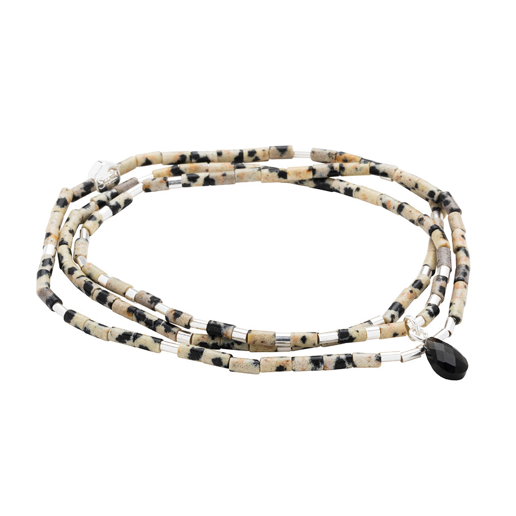 Teardrop Stone Wrap in Dalmatian Jasper, Obsidian & Silver by Scout Curated Wears. Inspires joy and grounding. Versatile design. Available at Be Charmed.