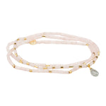 A pink semi-precious stone teardrop wrap bracelet with metallic accents and a faceted teardrop design. Available at Be Charmed