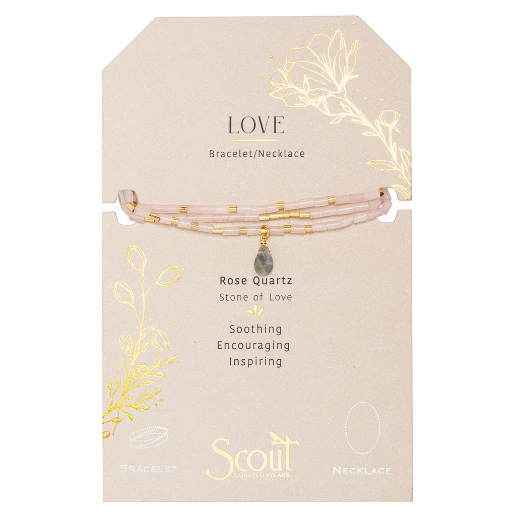 Displayed on card Teardrop Stone Wrap in Rose Quartz & Gold by Scout Curated Wears. Promotes love, self-worth, and compassion. Elegant & gift-ready. Available at Be Charmed.