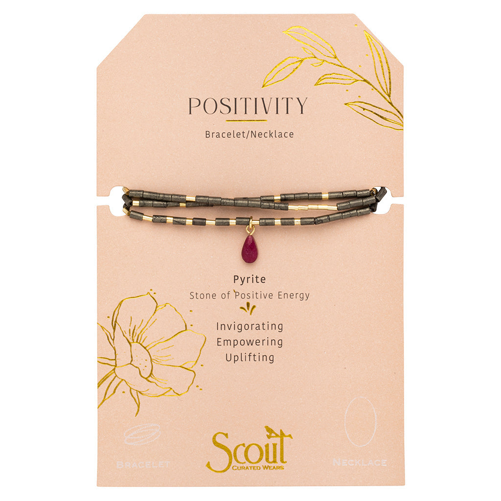 Displayed on Card Teardrop Stone Wrap in Pyrite, Fuchsia & Gold by Scout Curated Wears. Adds sparkle and vibrant energy. Wear as necklace or bracelet. Available at Be Charmed.