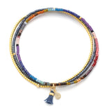 Mixed dark beaded bracelet with gold accents on a white background. Available at Be Charmed