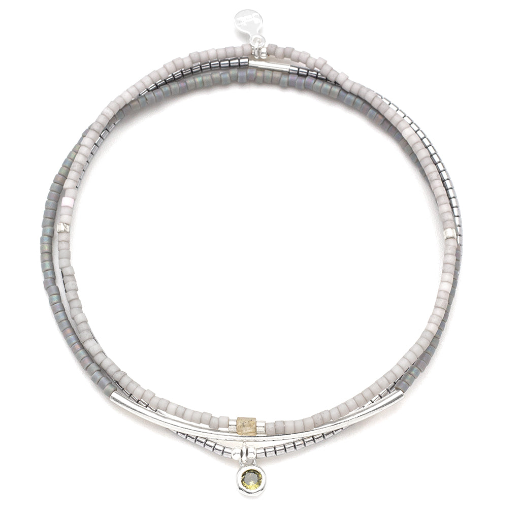 Beaded bracelet with silver accents on a white background. Available at Be Charmed
