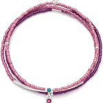 Pink beaded bracelet with silver and turquoise accents on a white background. Available at Be Charmed
