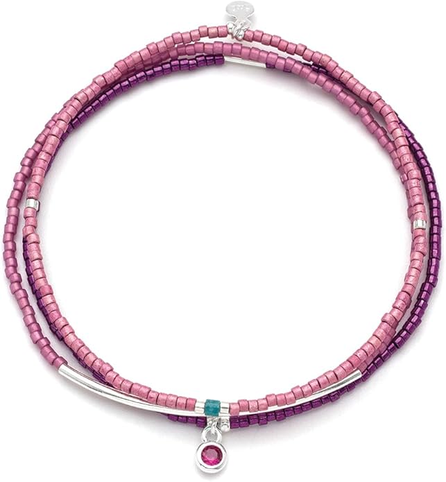 Pink beaded bracelet with silver and turquoise accents on a white background. Available at Be Charmed