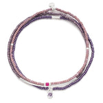 Purple beaded bracelet with silver accents on a white background. Available at Be Charmed
