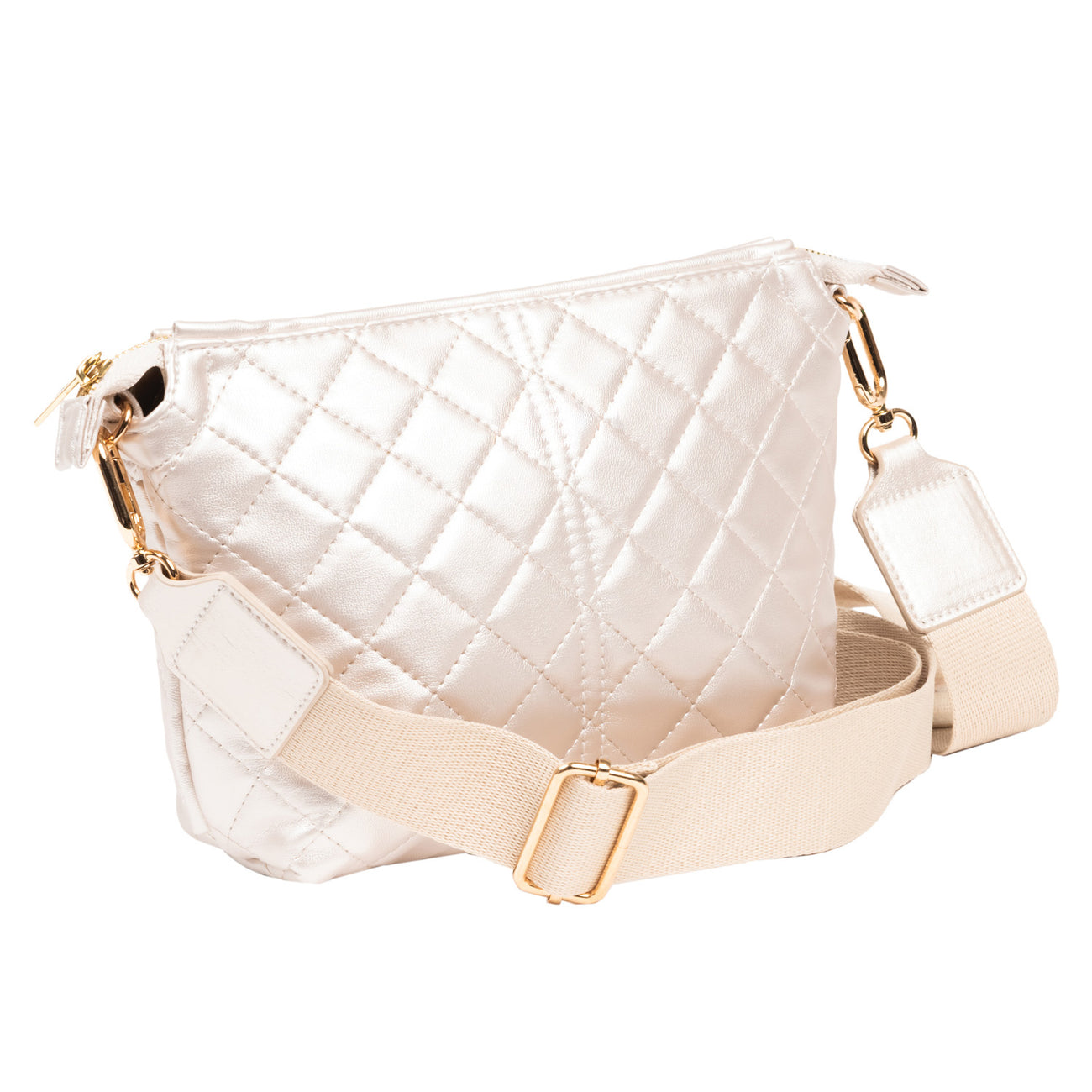 Scout Champagne Quilted Emily crossbody bag with adjustable strap & zippered compartments – available at Be Charmed