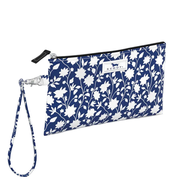 Floral patterned wristlet with wrist strap on a light gray background. Available at Be Charmed